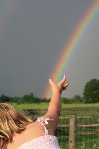 girl reaching for rainbow - What Do You Want Jesus to Do for You